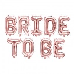 Foliowe balony w kolorze różowego zdjęcia w postaci napisu bride to be. 