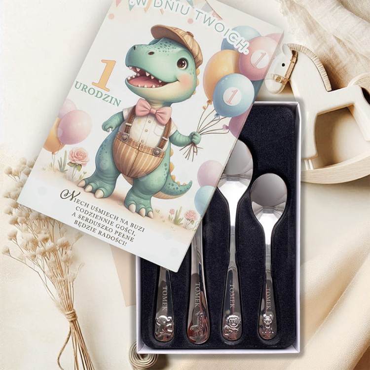 Biały nietłukący kubek z napisem „Mam już 1 roczek” i pastelowym nadrukiem dinozaura.