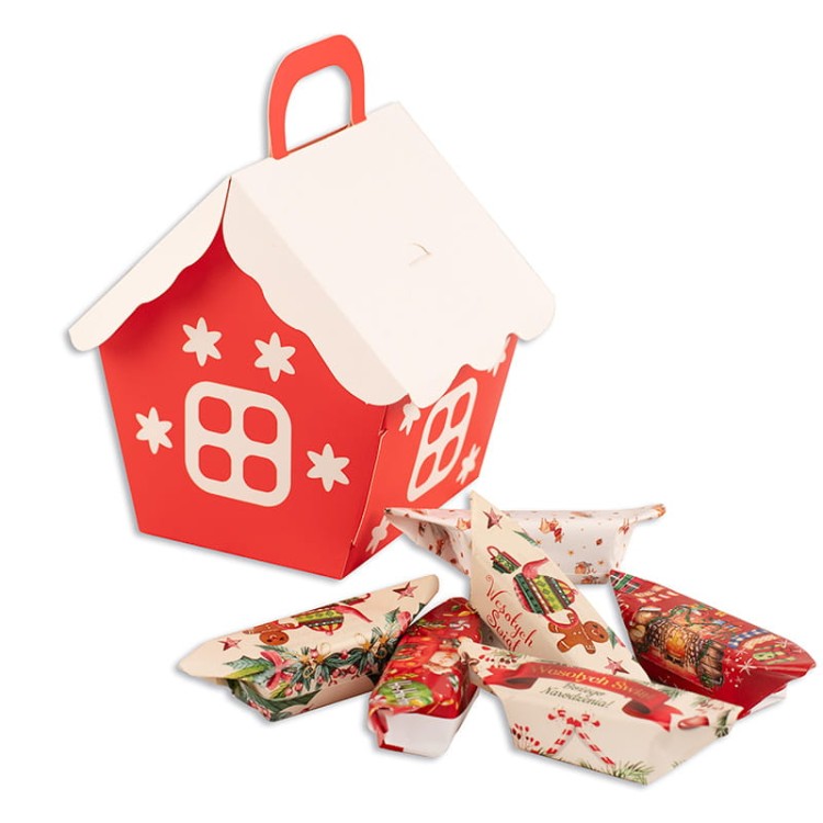 Świąteczny upominek w formie domku z kolorowymi krówkami jako prezent na Boże Narodzenie.