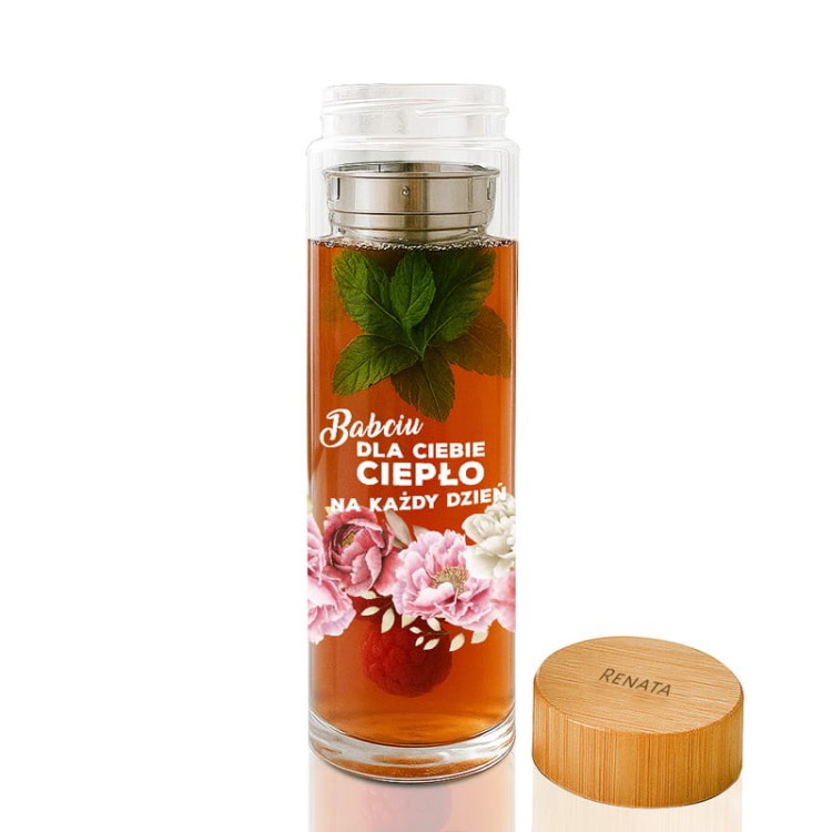 Butelka z naparem, malinami i liśćmi mięty wygląda elegancko i świeżo.