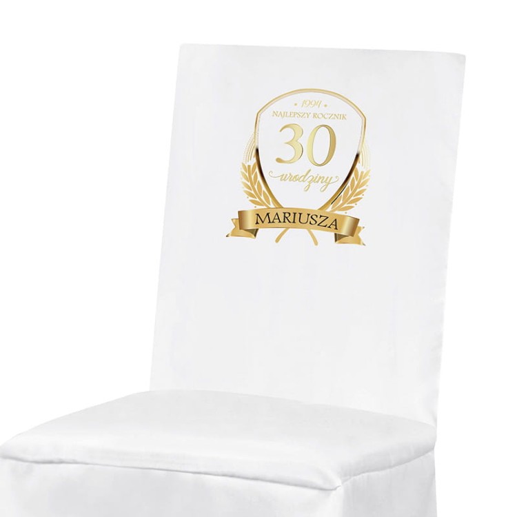 Personalizowana dekoracja urodzinowa z rocznikiem na krześle.