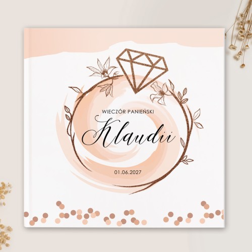 Elegancka księga gości z motywem pierścionka zaręczynowego.