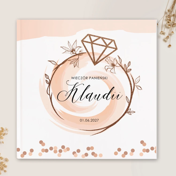 Elegancka księga gości z motywem pierścionka zaręczynowego.