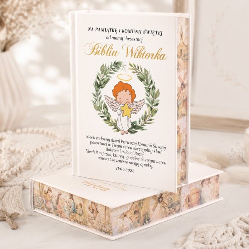 Biblia z motywem aniołka i barwionymi brzegami.