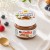 Mini Nutella na koniec roku szkolnego z etykietą „Udanych wakacji!” i pastelową grafiką.