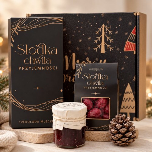 Czarny zestaw świąteczny ze słodyczami w ozdobnym pudełku prezentowym.