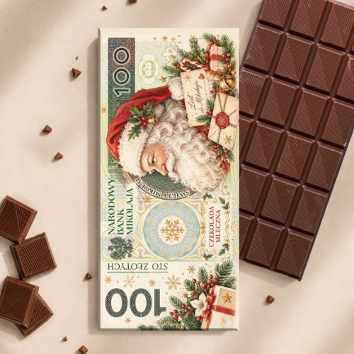 Czekolada mleczna w świątecznym opakowaniu z Mikołajem jako element zestawu prezentowego.